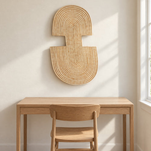 Abstract Wall Mask 2 hung on a warm white wall above a plain oak desk and chair