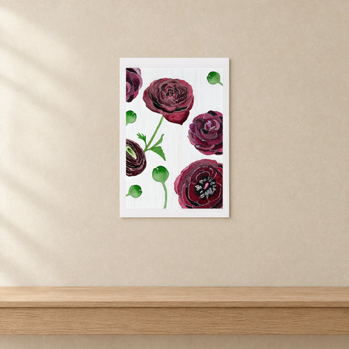 Unframed Black Ranunculus on Snow print, 13 × 19 in size, on a limewash wall above an oak console