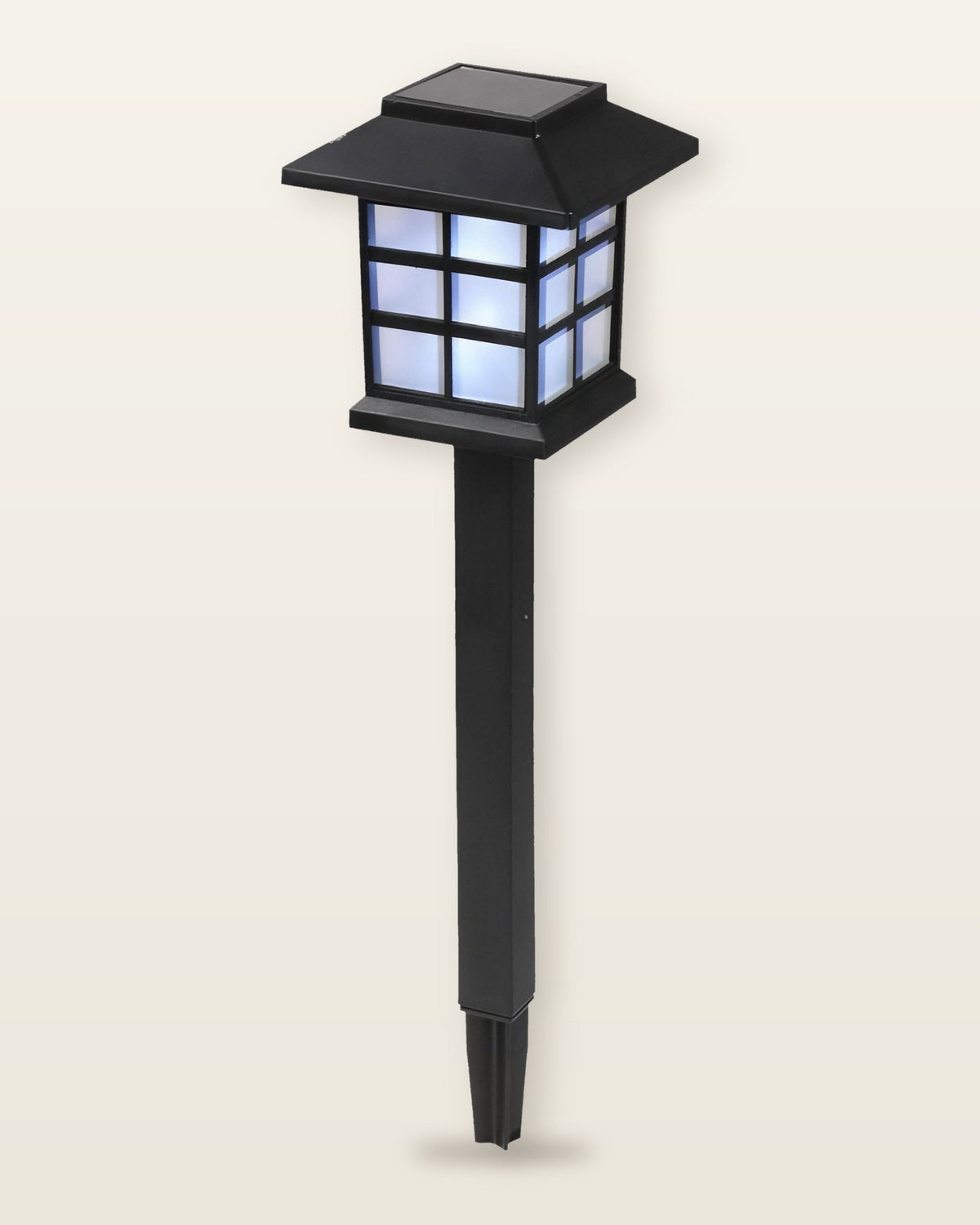 One pagoda solar lantern shown whole, from the roof to the tip of its two-part ground stake