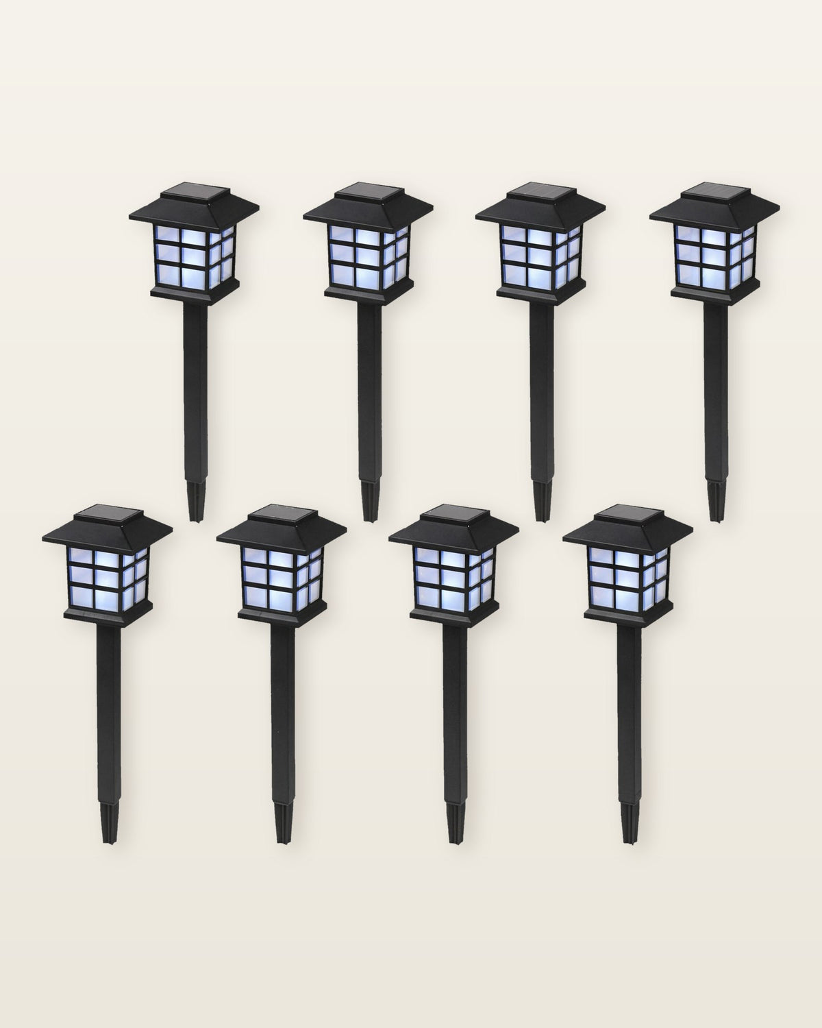 The set of eight black pagoda solar path lanterns on ground stakes, in two rows